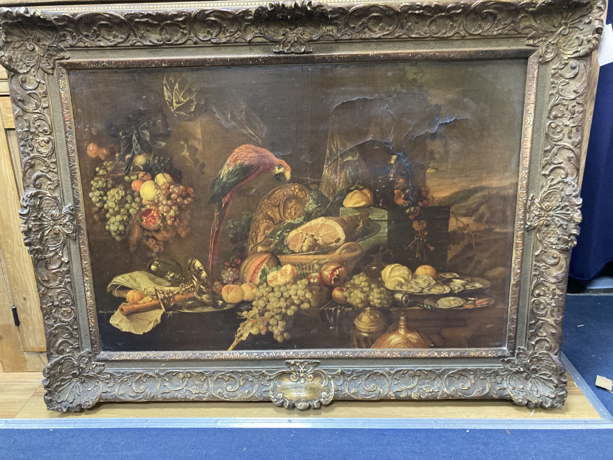 After De Heem (1600-1671), colour print, Still life (a.f.), housed in an ornate gilt gesso frame, aperture 65 x 96cm